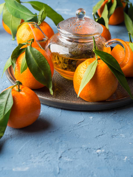 istock Tangerines and green tea still life 893024404