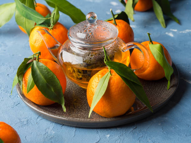 istock Tangerines and green tea still life 893024536