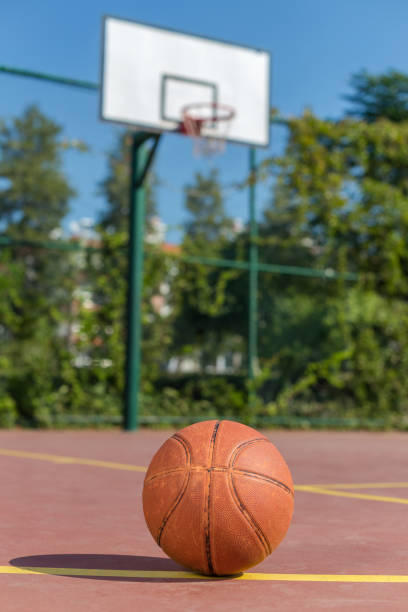 istock A basketball with a hoop in the background 893024622