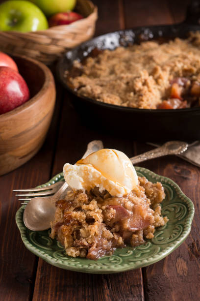 Apple Crumble Apple Crumble (or Apple Crisp) baked in a cast iron skillet apple pie and ice cream stock pictures, royalty-free photos & images