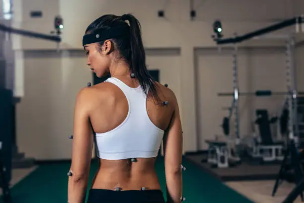 Photo of Woman with motion capture sensors at sports science lab