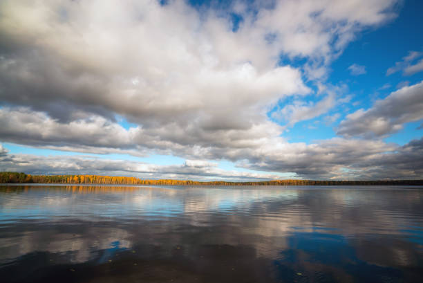 White clouds over the lake in the fall.