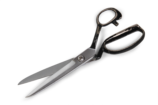 Old-fashioned scissors on the white backgaund