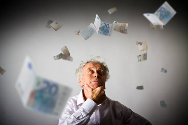 old man in white and falling euro banknotes. currency and lottery concept. - 2281 imagens e fotografias de stock