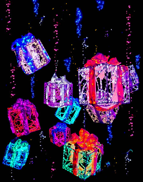 Brightly Colored Packages with Ribbons and Bows Hanging with Holiday Lights