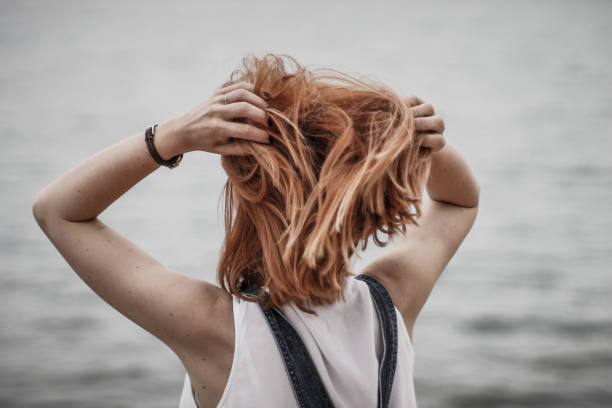 istock Woman touching her hair 893071476