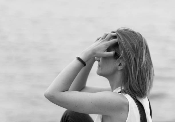 istock Woman touching her hair 893071584