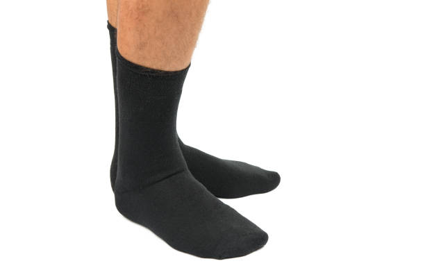 istock socks on the legs of a man isolated 893078844