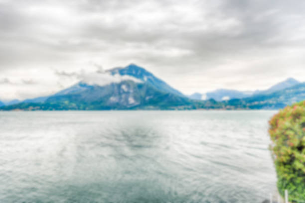 Defocused background with scenic idillic view over the Lake Como from the town of Varenna, Italy. Intentionally blurred post production for bokeh effect