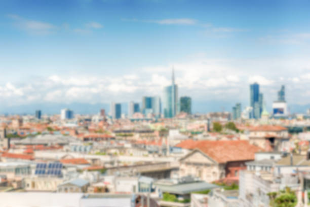 Defocused background with scenic aerial view over the city centre, as seen from the roof of the gothic Cathedral, Milan, Italy. Intentionally blurred post production for bokeh effect