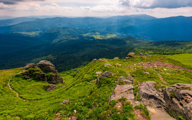 istock footpath amoung huge rocks on the edge of a hill 893079540