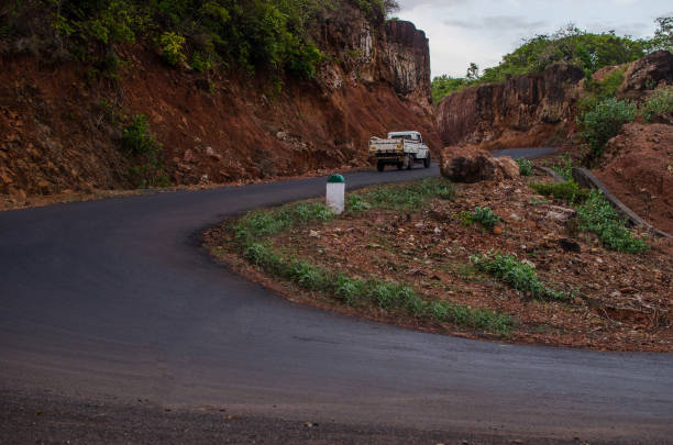 istock A road with curves going uphill and vehicle 893092074