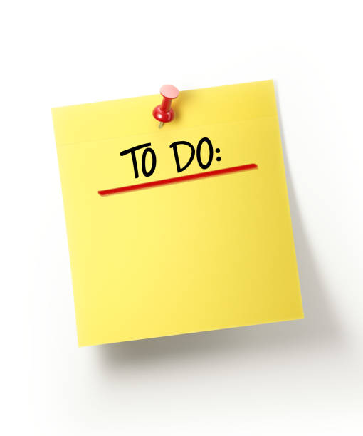 istock Yellow Sticky To Do List and Red Push Pin on White 893092544