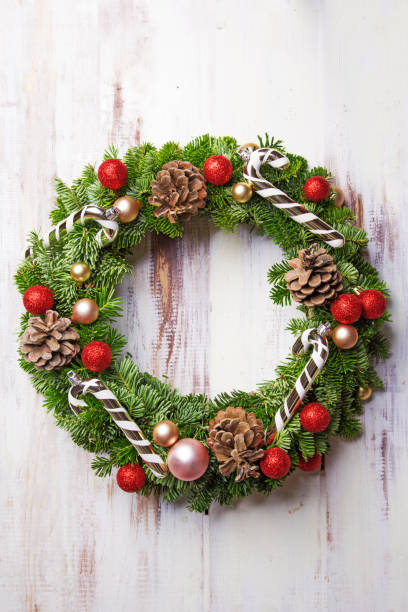 istock Christmas wreath on a wooden background. Top view. Copy space 893098452