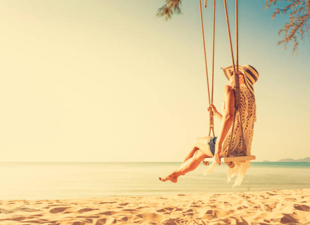 istock Woman at tropical swing 893101908
