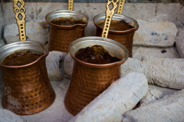 istock preparing coffee in pots on hot coals 893102200