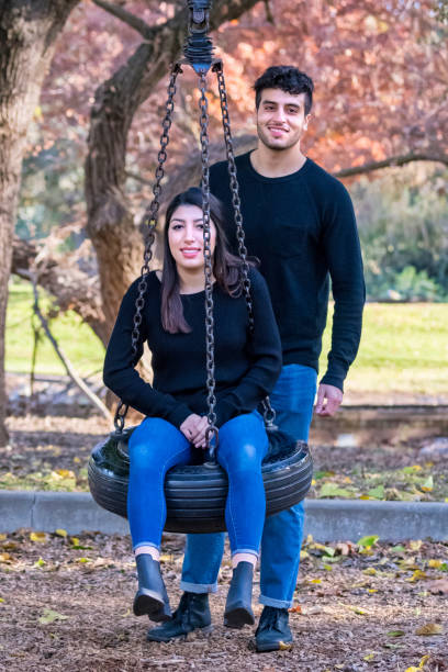 istock young couple having fun at the park 893102522