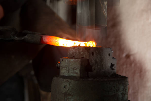 istock Blacksmith Working Hot Piece Of Metal On Forging Hammer 893102662