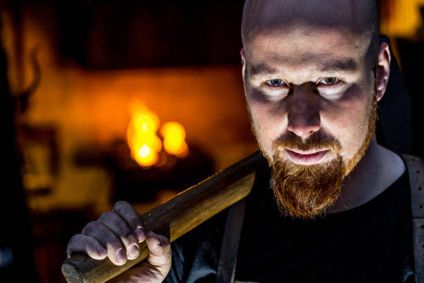 Portrait Of Young Blacksmith Holding Hammer