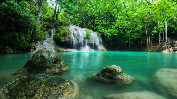 istock Breathtaking green waterfall at deep forest, Erawan waterfall located Kanchanaburi Province, Thailand 893102894