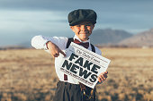Old Fashioned News Boy Holding Fake Newspaper