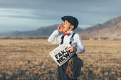 Old Fashioned News Boy Holding Fake Newspaper