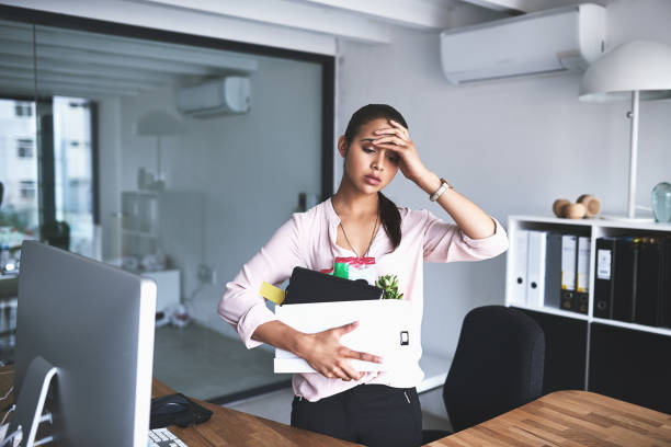 It's the most stressful thing that could happen to anyone Shot of an unhappy businesswoman holding her box of belongings after getting fired from her job being fired stock pictures, royalty-free photos & images
