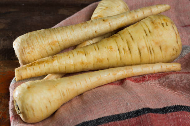 istock Uncooked parsnip roots new harvest 893115650