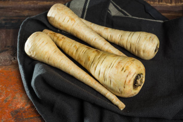 istock Uncooked parsnip roots new harvest 893115658