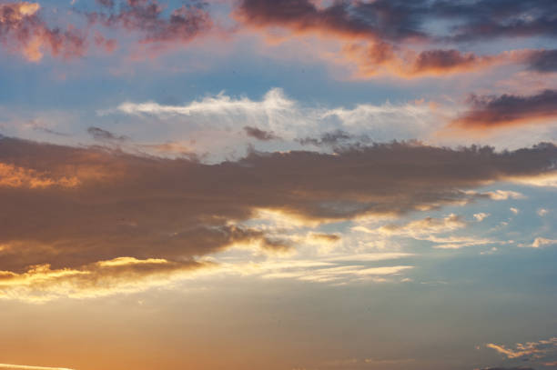 istock Sky background or texture at the sunset time with clouds. Copy space 893121072