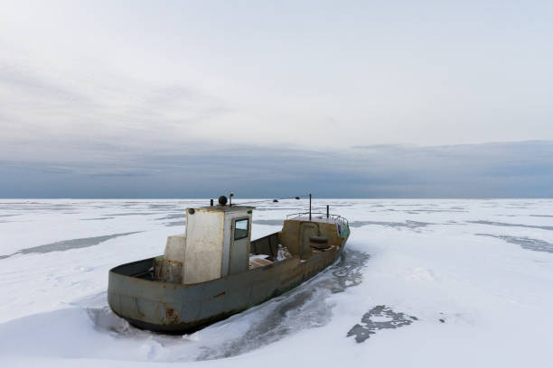 istock Frozen rusty longboat at Ladoga Lake 893132984