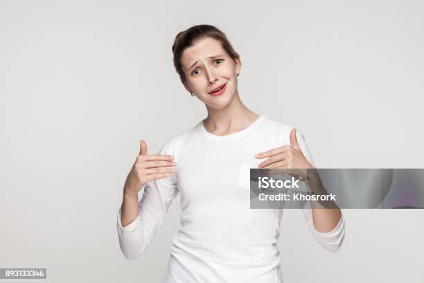 Puffy Funny Woman Pointing Hands Himself And Looking At Camera Stock Photo - Download Image Now