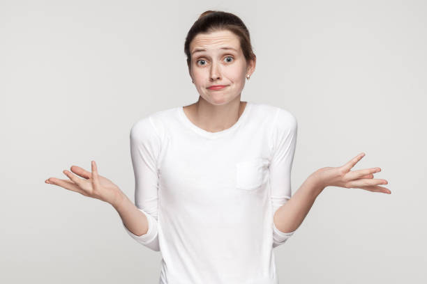 istock Confused beautiful girl looking at camera 893133358