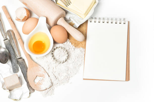 istock Cookies ingredients eggs flour Recipe book Baking Food background 893133690