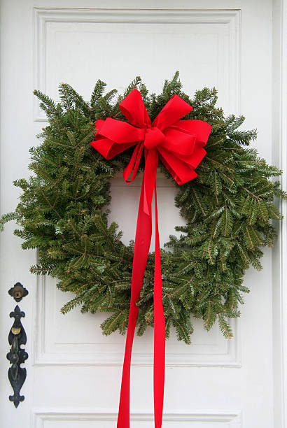 istock Door with pine Christmas wreath and bow 89315420