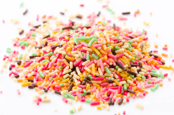 istock Colored sprinkles,decoration for cake and bekery, Colored sprinkles white background, 893155286