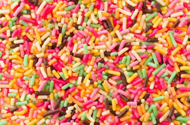 istock Colored sprinkles,decoration for cake and bekery, Colored sprinkles texture 893155290