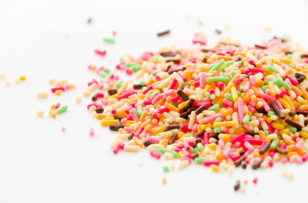 istock Colored sprinkles,decoration for cake and bekery, Colored sprinkles white background, 893155314