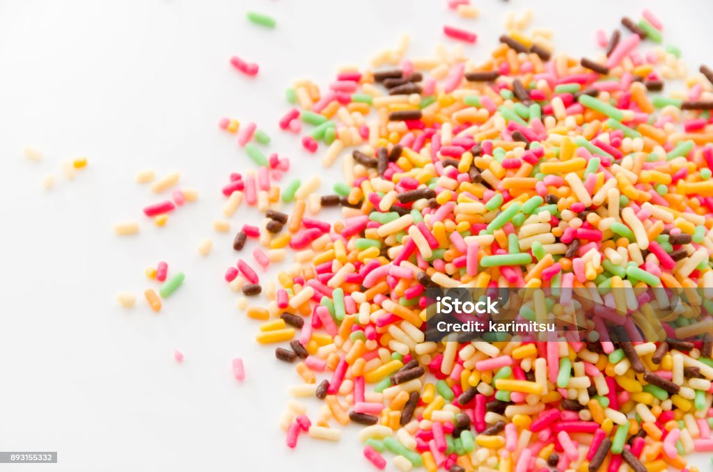 Bunte Streusel, Dekoration für Kuchen und Bekery, bunten Streuseln, weißer Hintergrund, - Lizenzfrei Bildhintergrund Stock-Foto