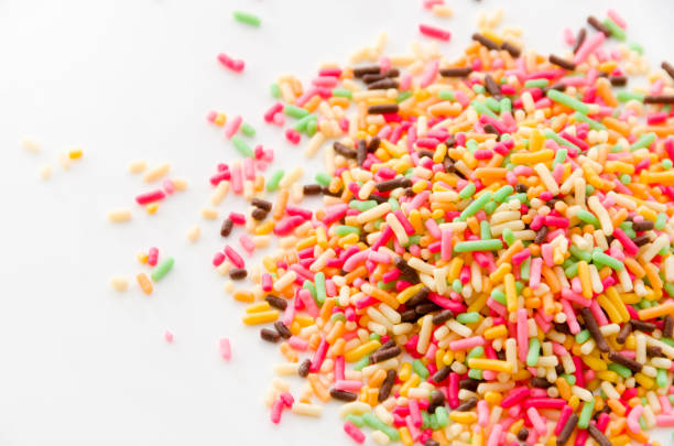 istock Colored sprinkles,decoration for cake and bekery, Colored sprinkles white background, 893155332