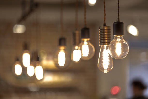 istock orange lights hanging from the living room. 893158316