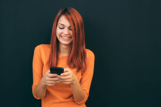 istock Woman texting on the phone 893160686