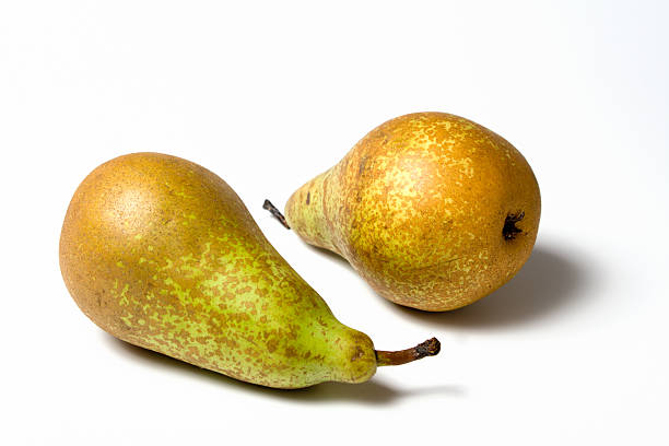 two pears isolated on white  conference pear stock pictures, royalty-free photos & images