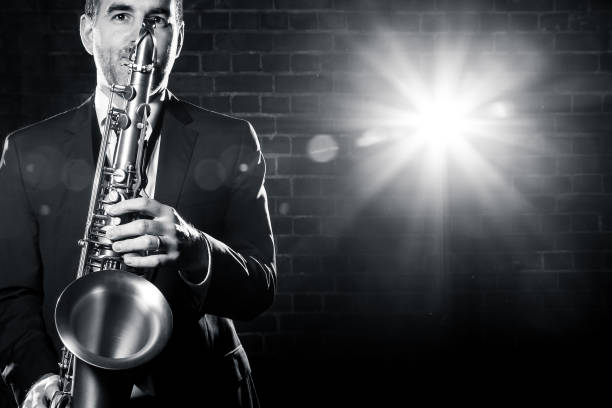 istock Saxophonist playing with passion at club 893171690