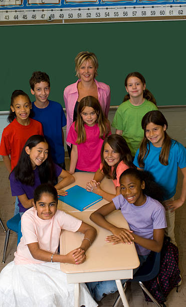 Teacher and Students in a Classroom stock photo