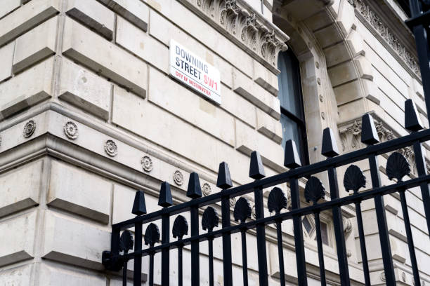 istock 10 Downing Street Sign and Black Security Fence 893196236