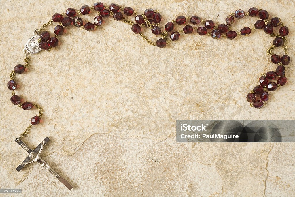 Rosary beads on stone with copy space  Rosary Beads Stock Photo