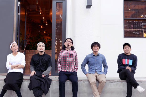 istock Cafe staff sitting outside 893215024