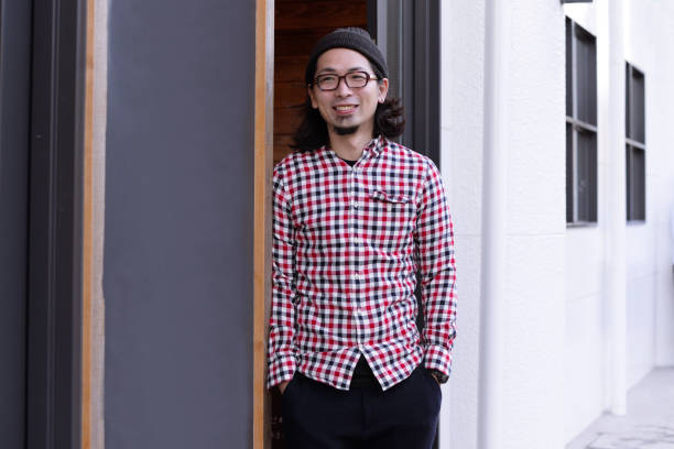istock Cafe owner standing at the entrance 893217682