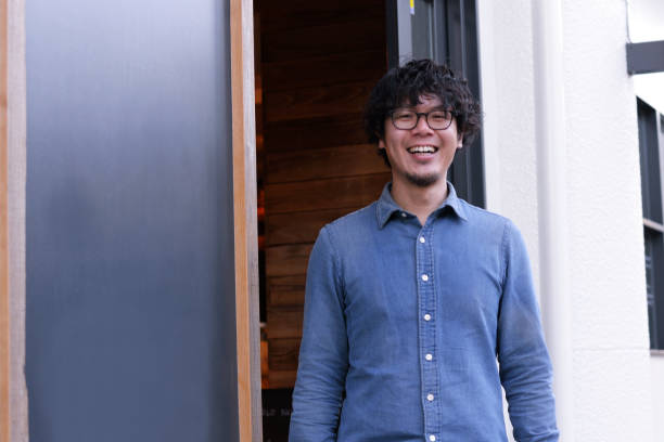 istock Cafe owner standing at the entrance 893217690